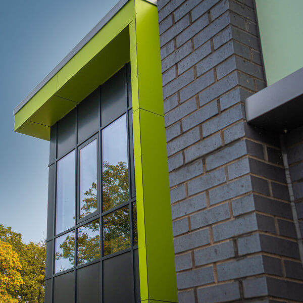 building with green window sills